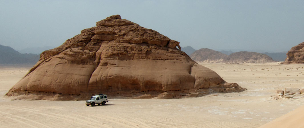 Jeep drive into the desert plain